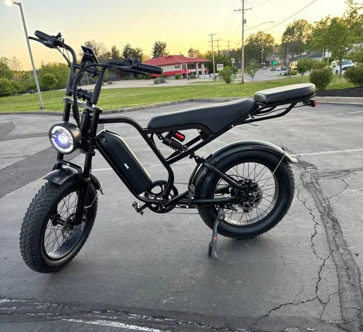 Fat-tire e-bike from our own stock, parked outdoors at sunset